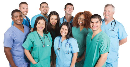 group of nurses of different ages and races wearing blue and green scrubs taking photo in photo studio