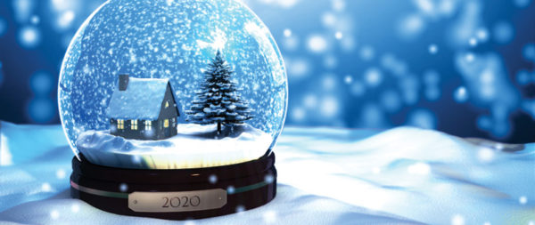 round glass snow globe sitting on a bed of white snow