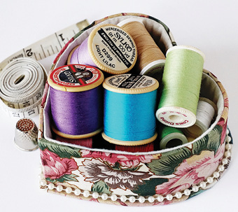 sewing kit with spools of thread in various colors