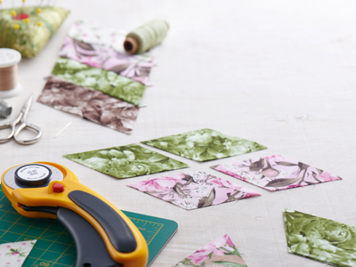 squares of quilting fabric and fabric cutters